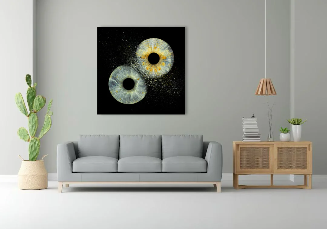 Modern office with eye art - desk, office chair, framed eye art on wall
